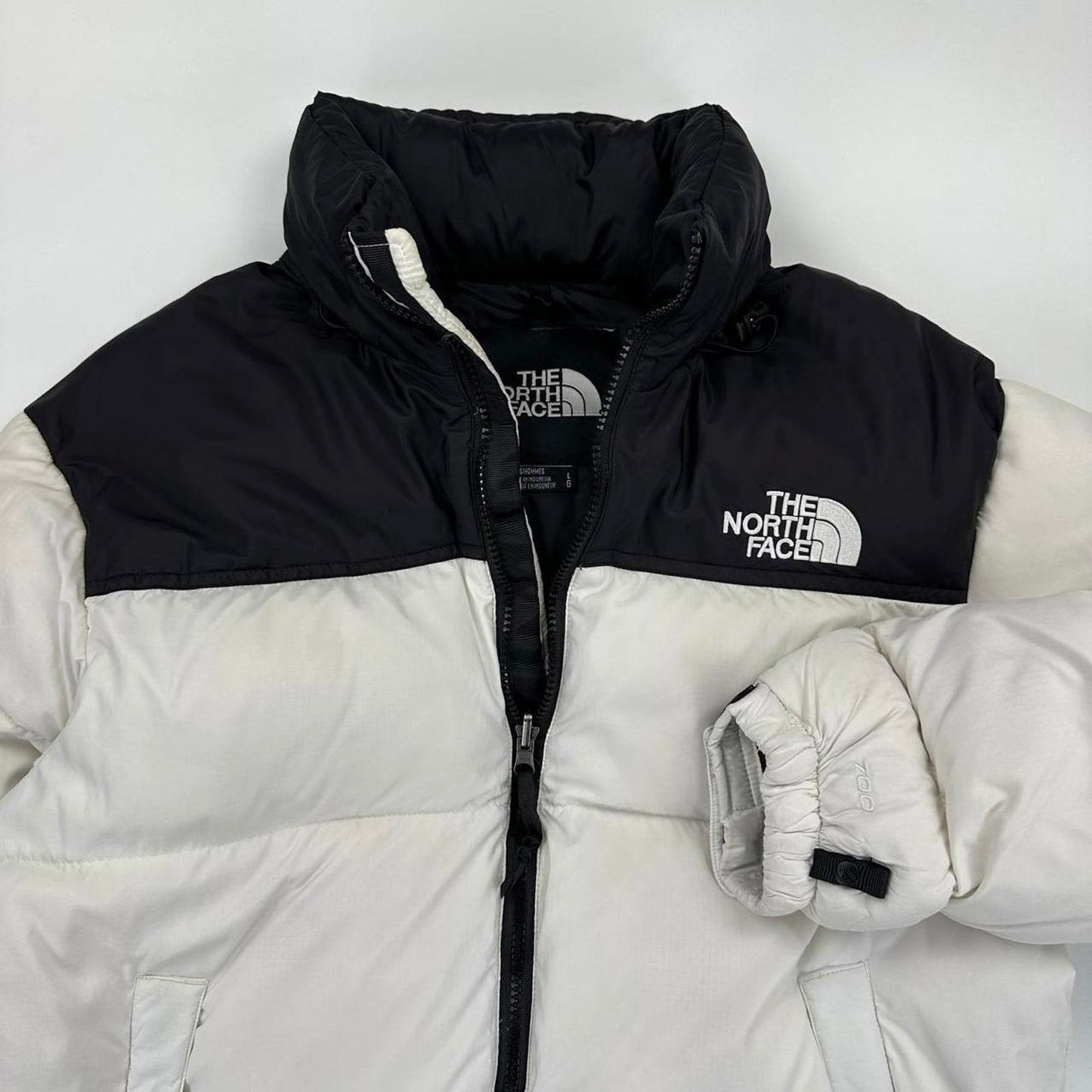 The North Face TNF 1996 Nuptse Puffer Jacket in white and black.