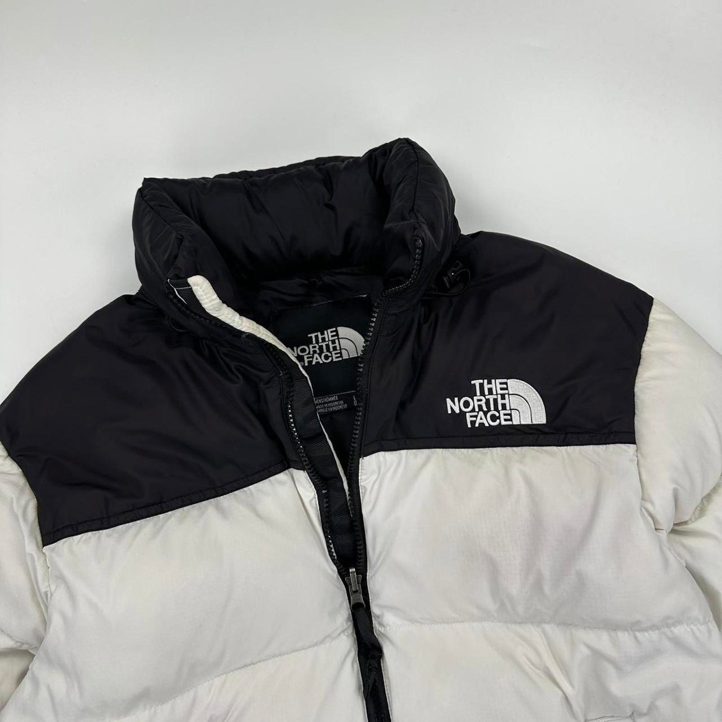 The North Face TNF 1996 Nuptse Puffer Jacket in white and black.