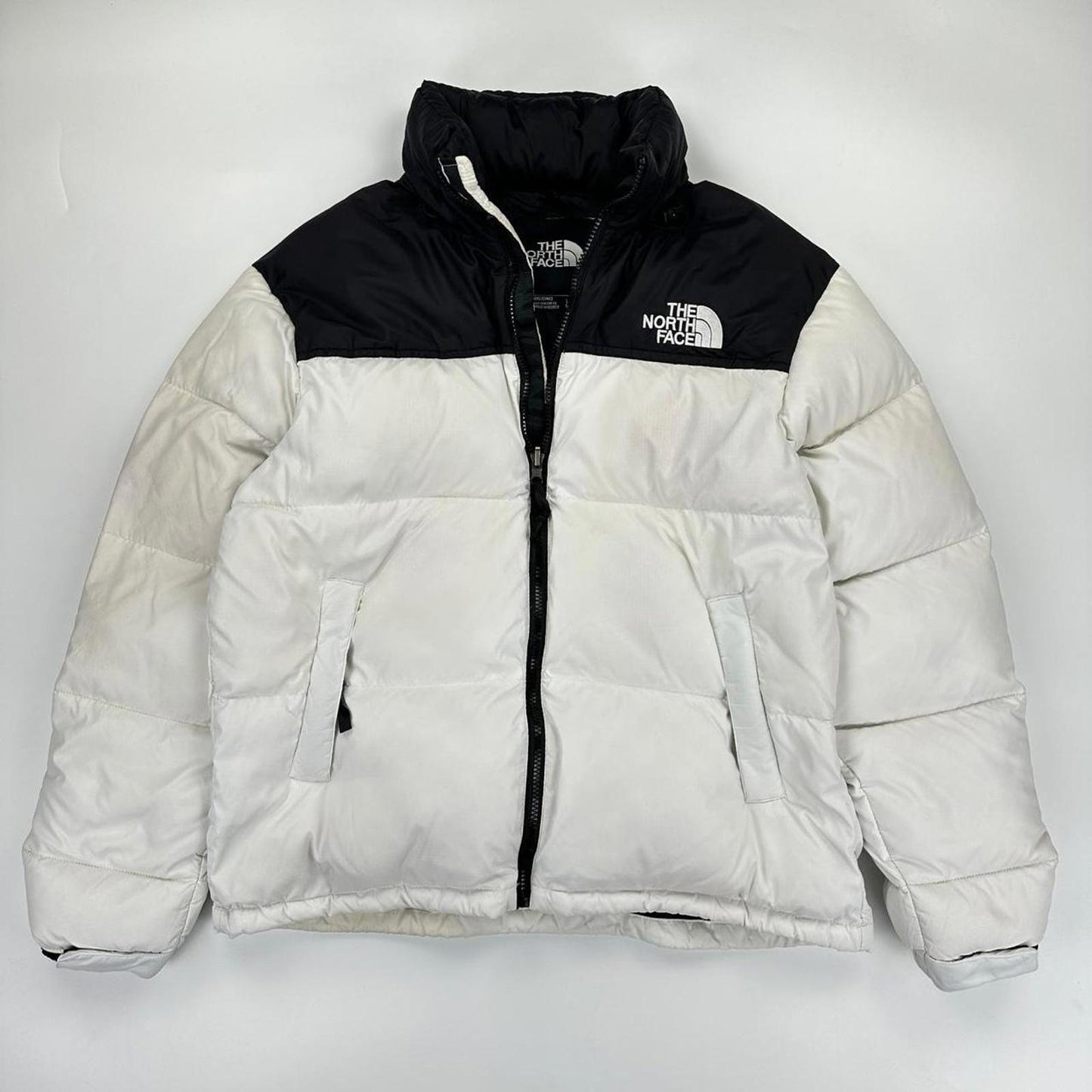 The North Face TNF 1996 Nuptse Puffer Jacket in white and black.