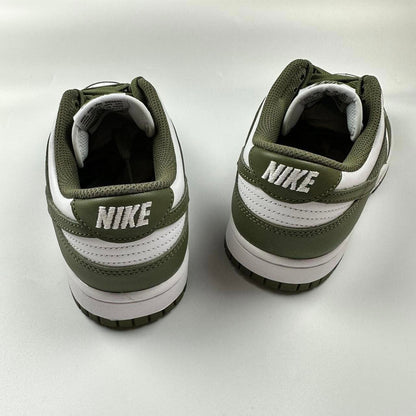 Nike Dunk Low in olive green and white.