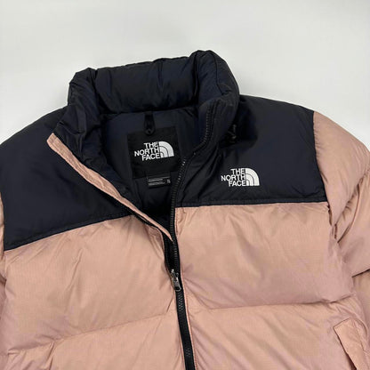 The North Face TNF 1996 Nuptse Puffer Jacket in light pink and black.
