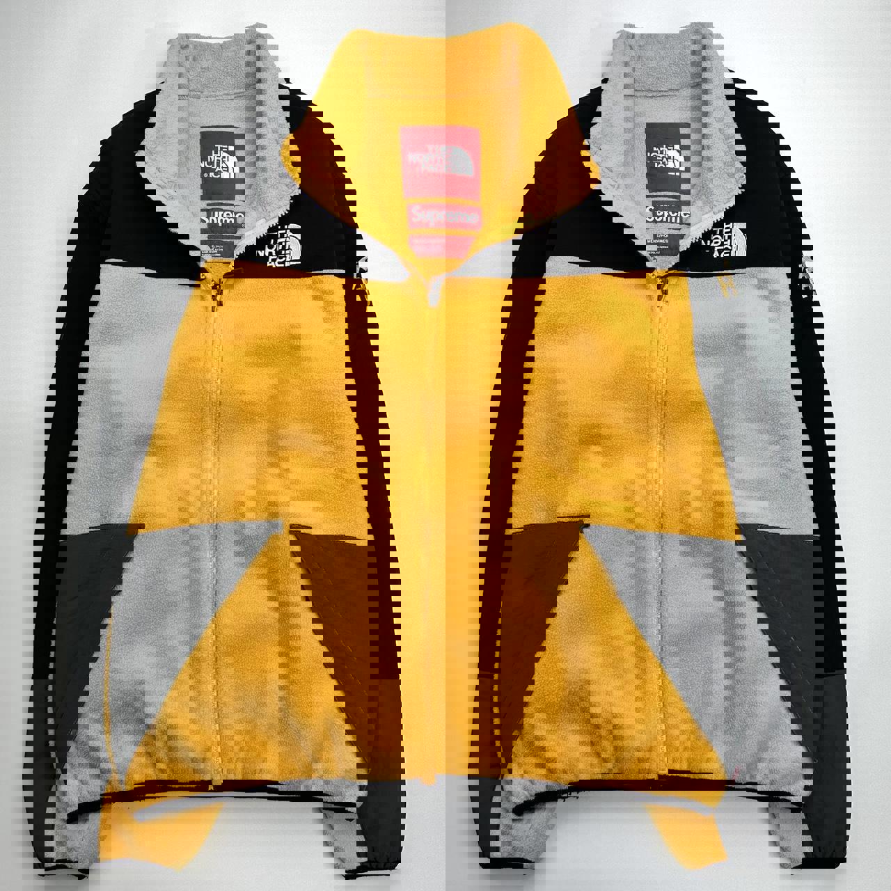 Supreme x The North Face TNF RTG Fleece Jacket in yellow and black.