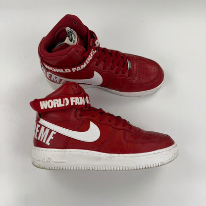Supreme x Nike Air Force 1 High World Famous sneakers in red.
