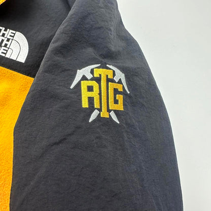 Supreme x The North Face TNF RTG Fleece Jacket in yellow and black.